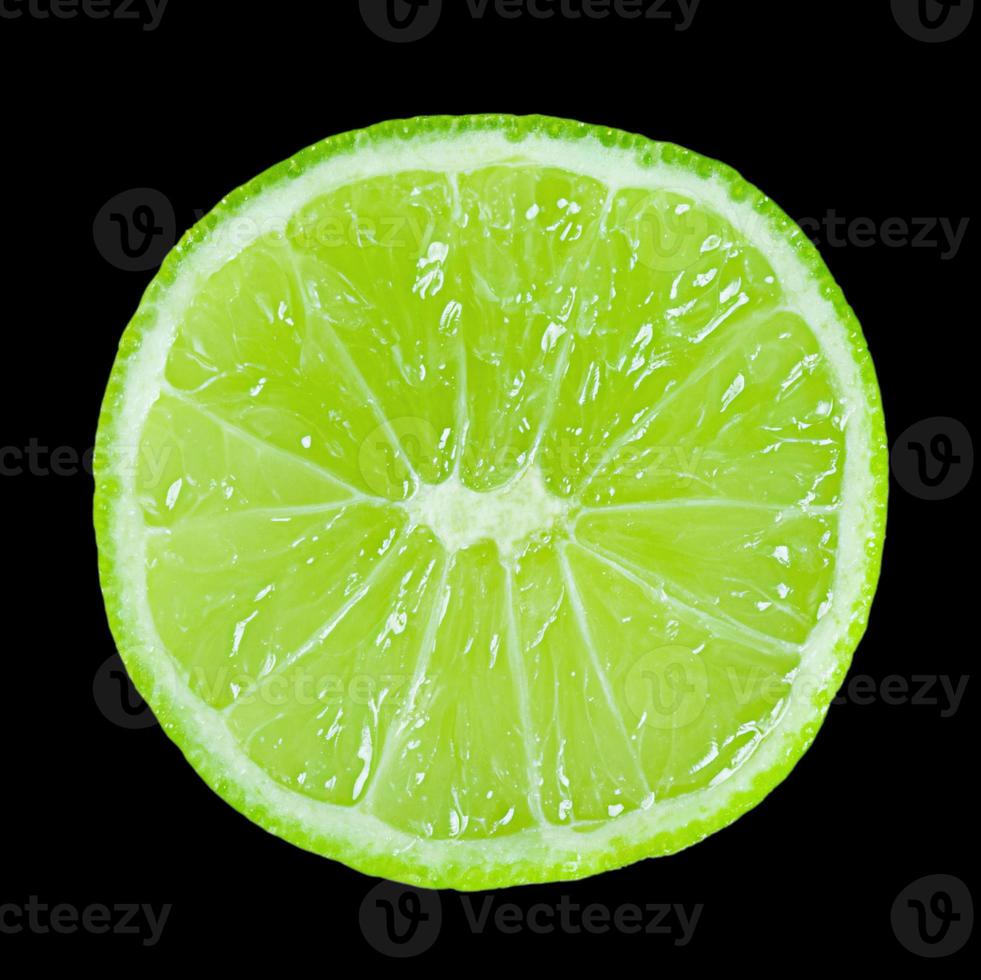 Lime slice isolated on a black background photo
