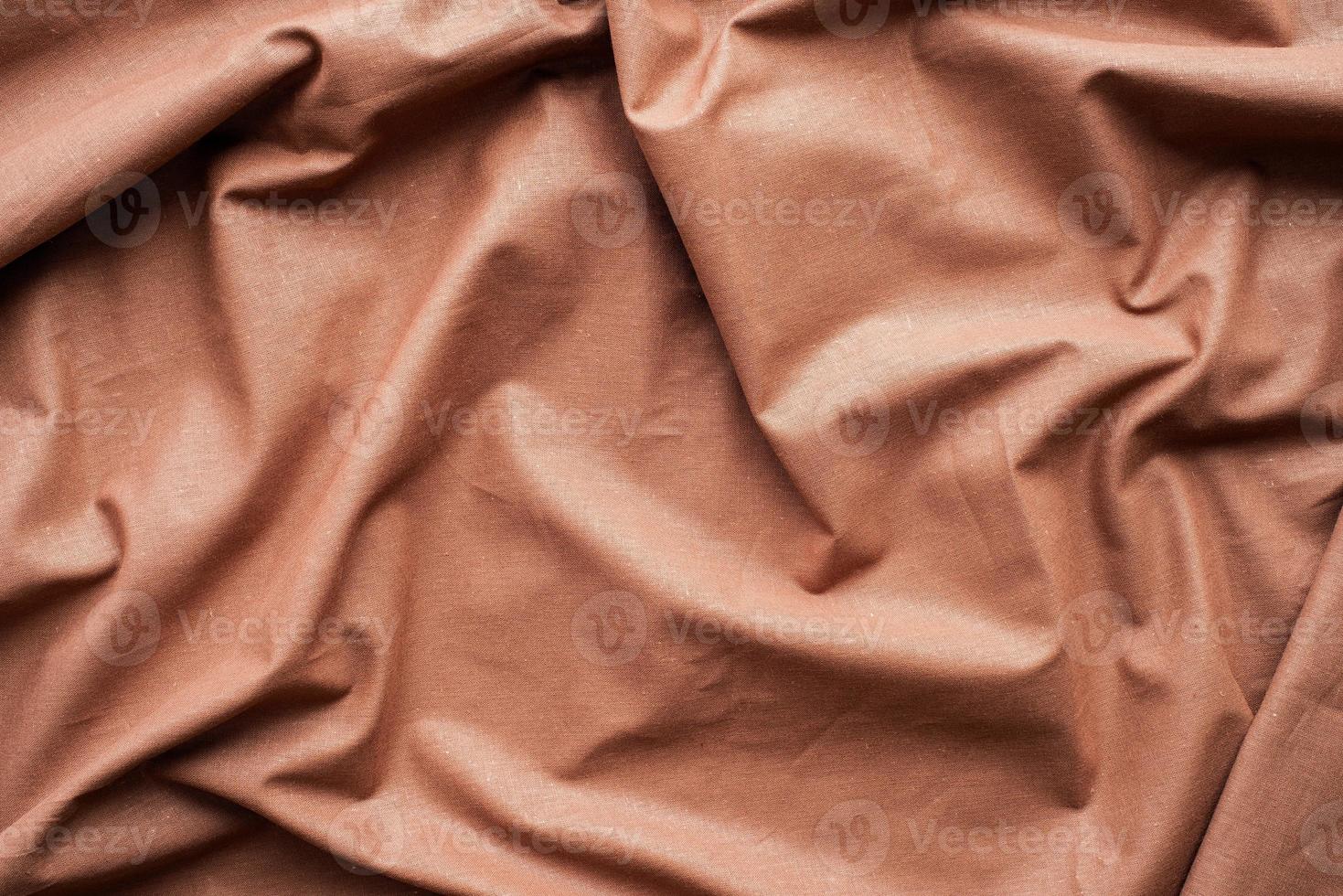 Chocolate brown fabric texture background, wavy fabric photo