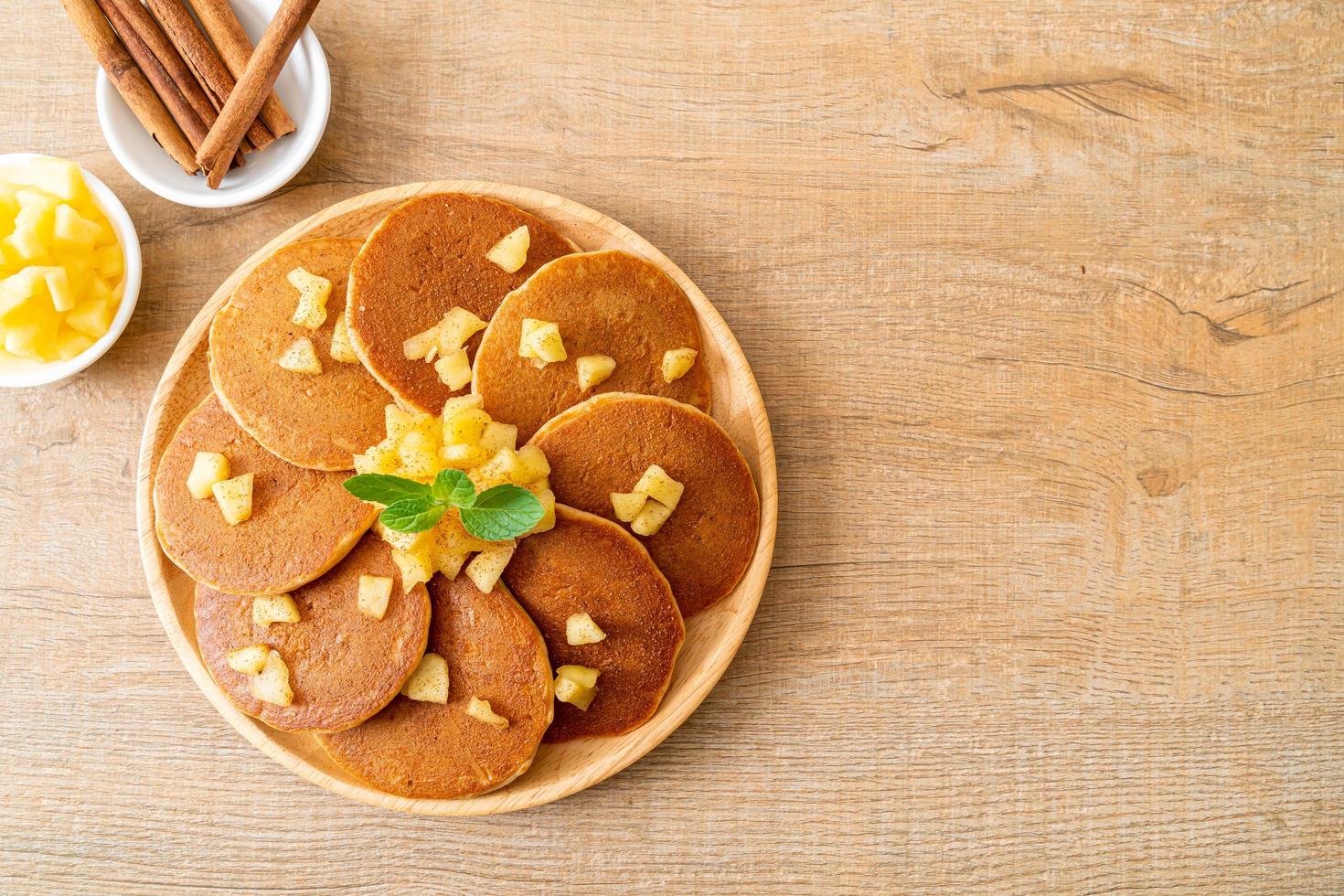 Apple pancake or apple crepe with cinnamon powder photo