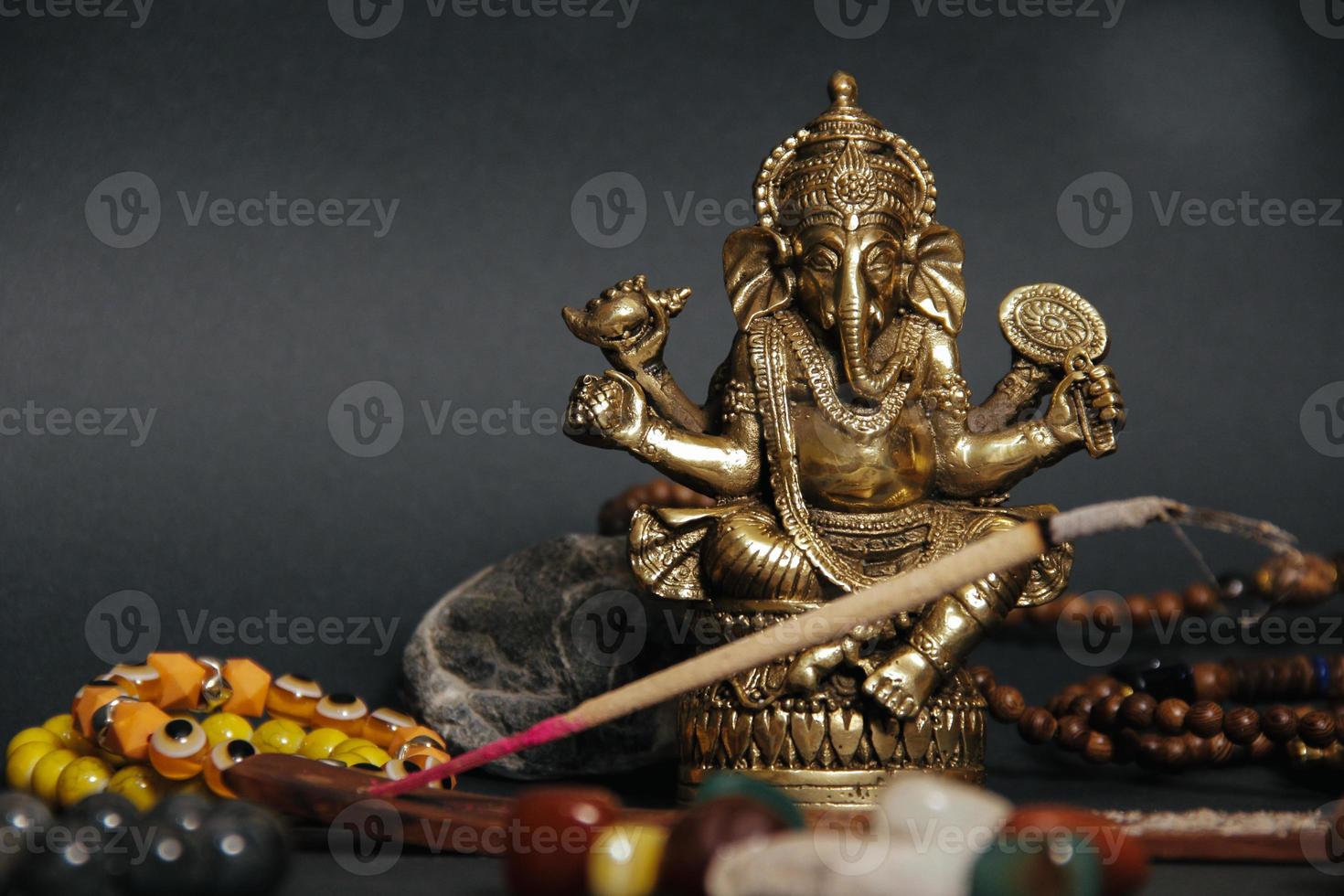 Table with occult attributes, top view. Ganesha figurine, photo