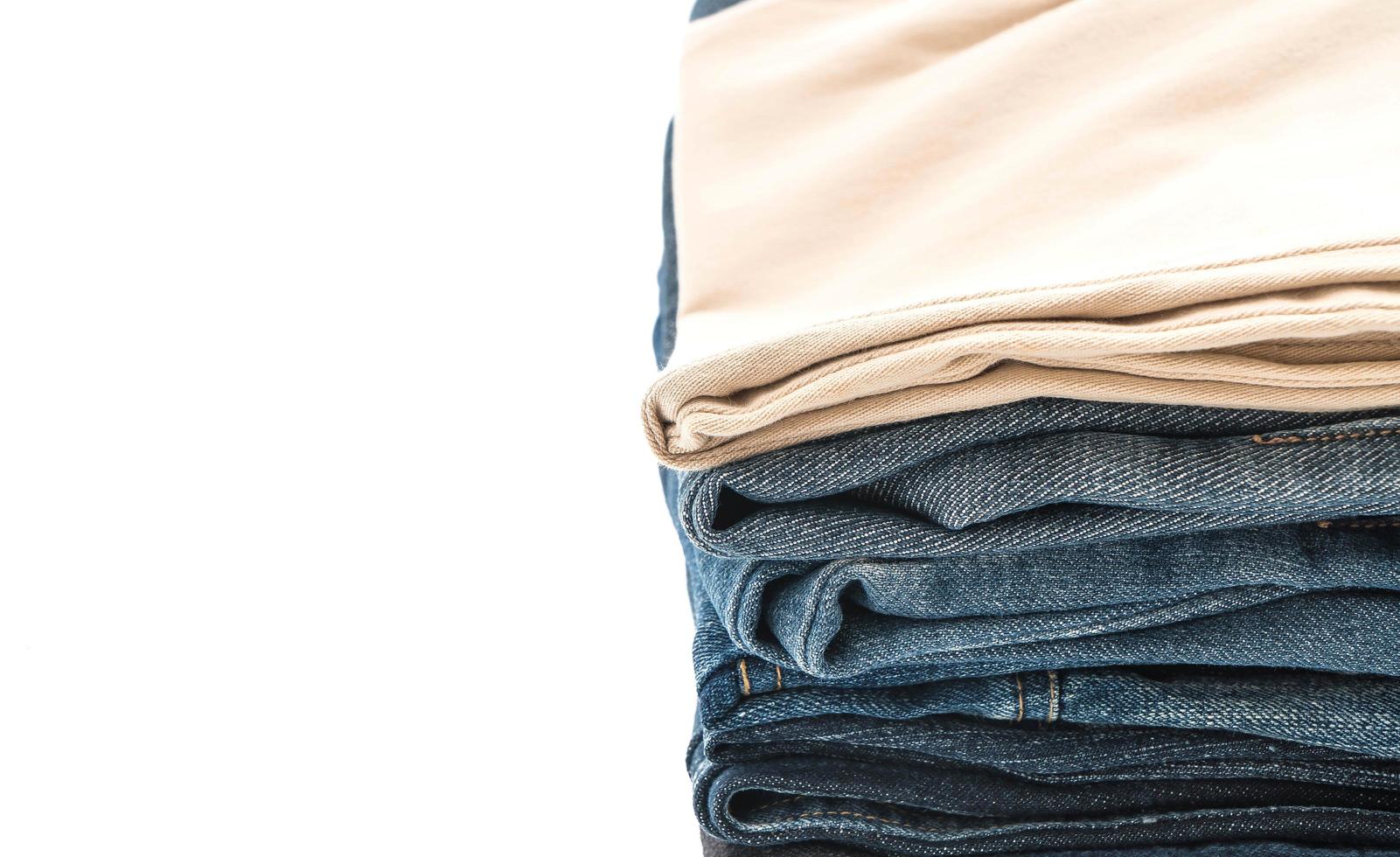 Stacks of clothing on white background photo