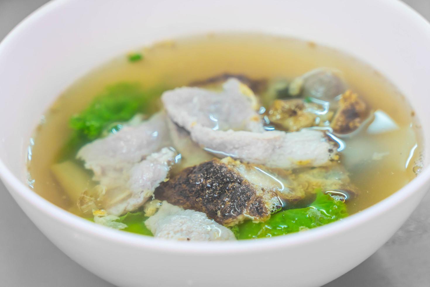 Pork with veggies in soup photo