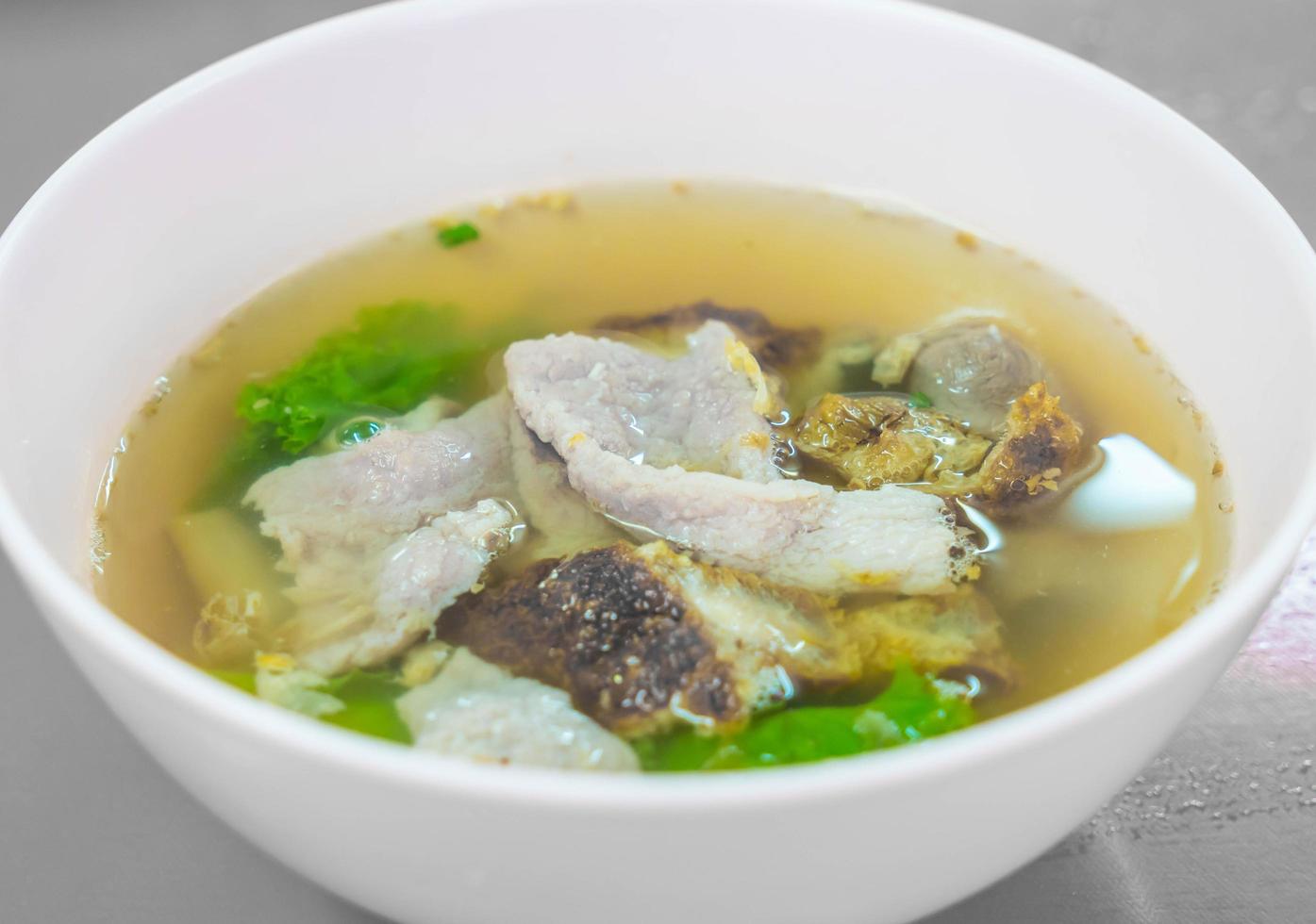 Pork with veggies in soup photo