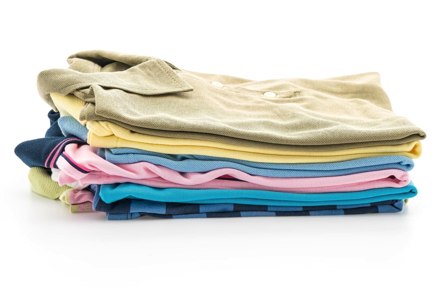 Stacks of clothing on white background photo