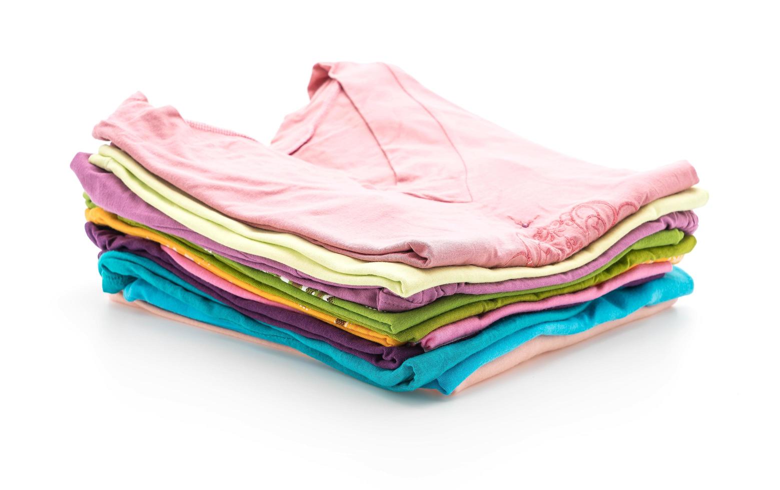 Stacks of clothing on white background photo