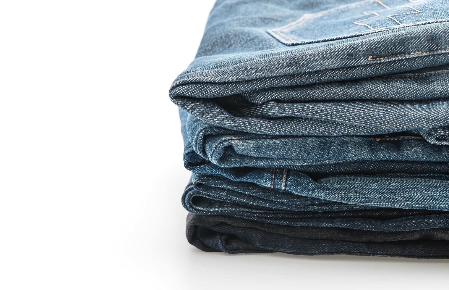 Stacks of clothing on white background photo