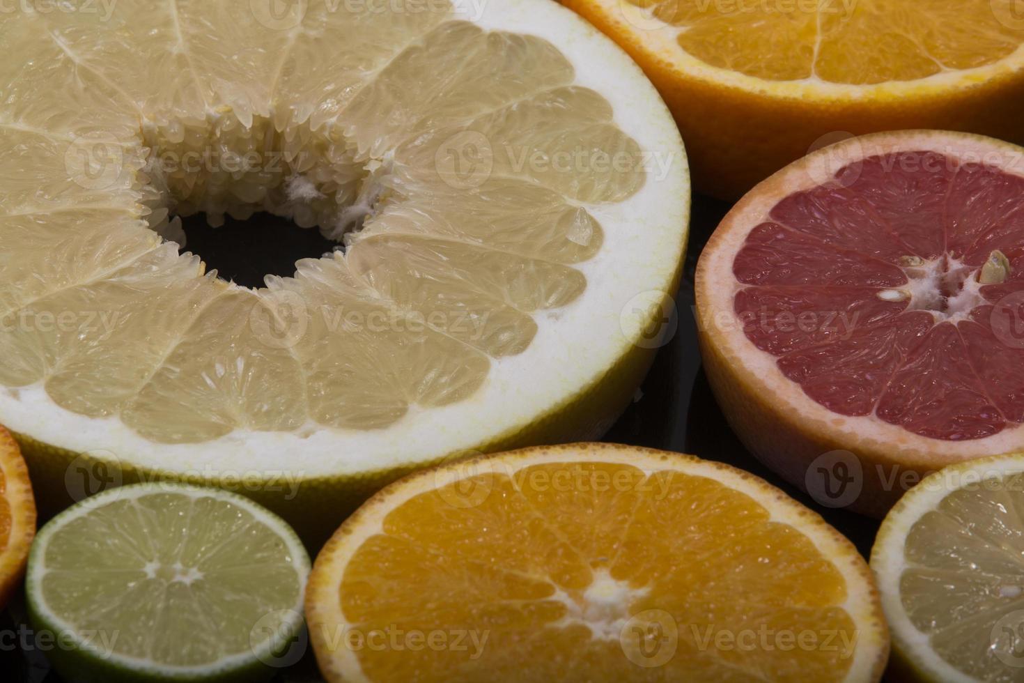 citrus on wooden background photo
