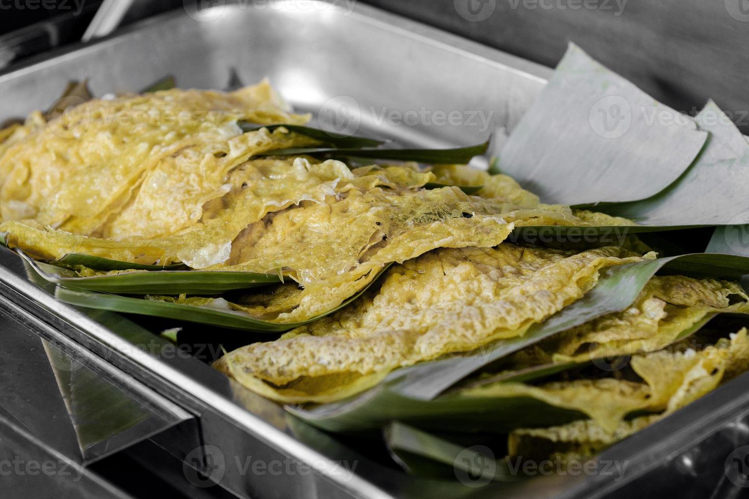 Banh Xeo crispy Vietnamese vegetable pancakes in buffet warmer tray at Hanoi restaurant photo