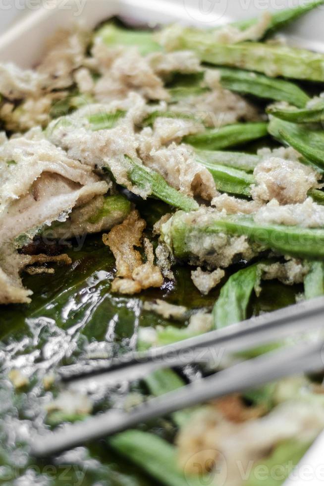 Mixed battered okra and cauliflower vegetable tempura in catering buffet tray photo