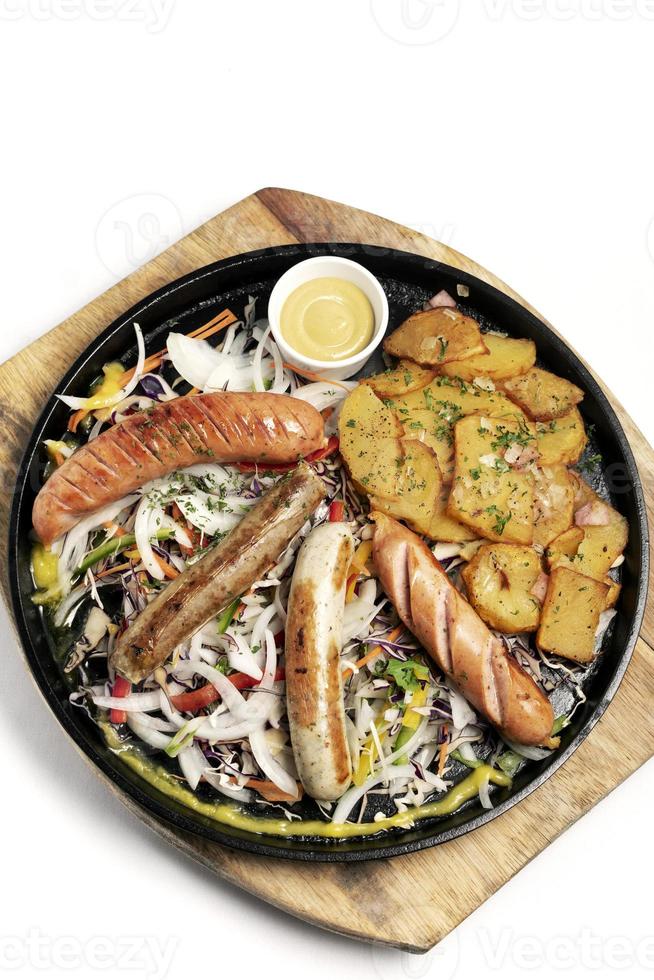 Mixed german traditional organic sausage and potato meal platter including Nurnberger, Lamb and Pork with salad and mustard photo