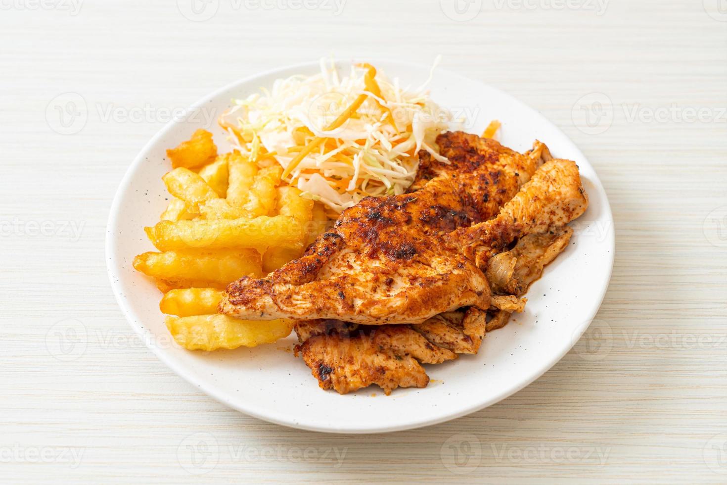 Grilled spicy barbecue chicken steak with french fries photo