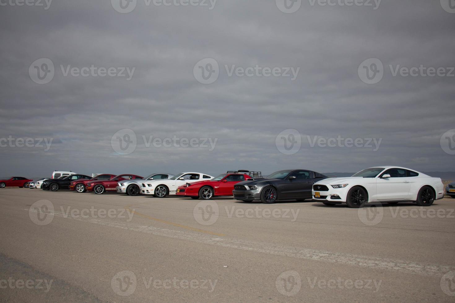 Cars on the race track and on the roads of the desert photo