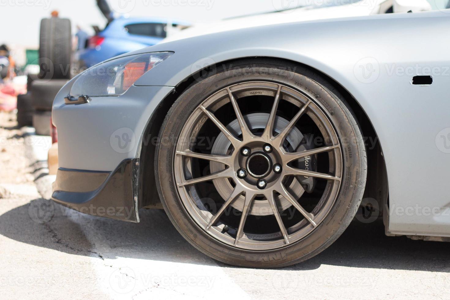 Cars on the race track and on the roads of the desert photo