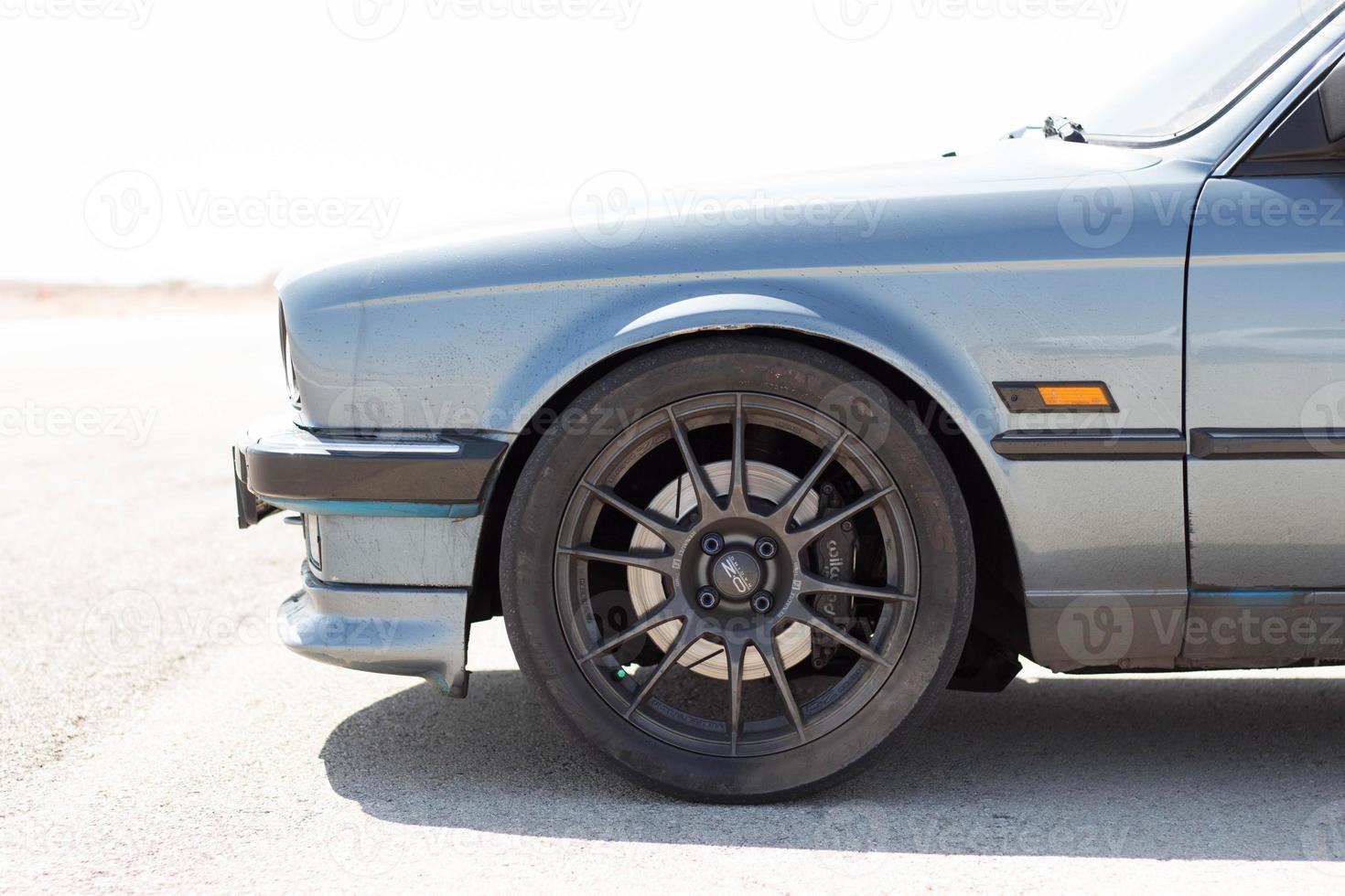 Cars on the race track and on the roads of the desert photo