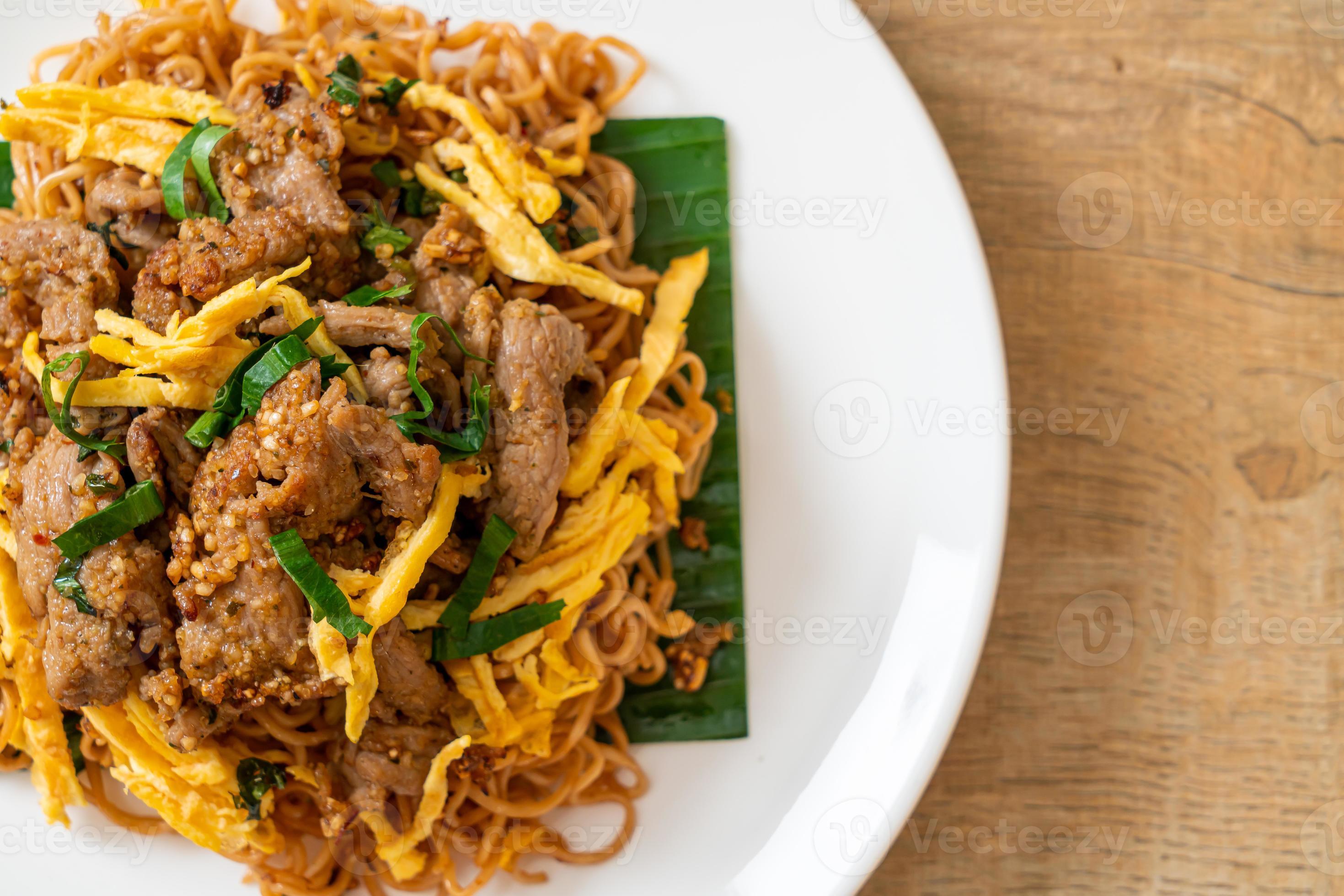 Stir-fried instant noodle with pork and egg - Asian local street food