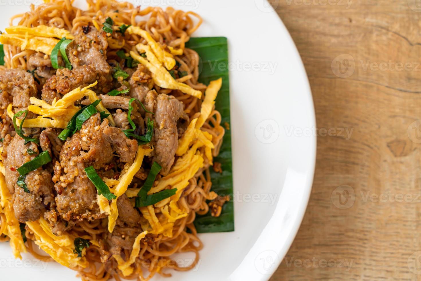 Stir-fried instant noodle with pork and egg - Asian local street food style photo