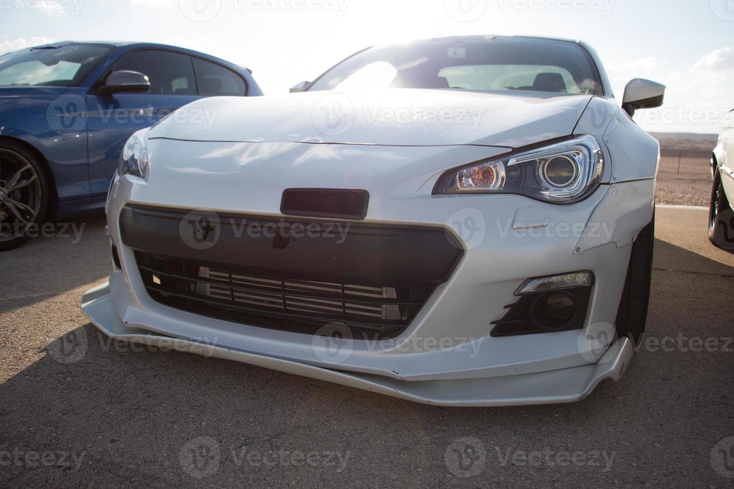 Cars on the race track and on the roads of the desert photo