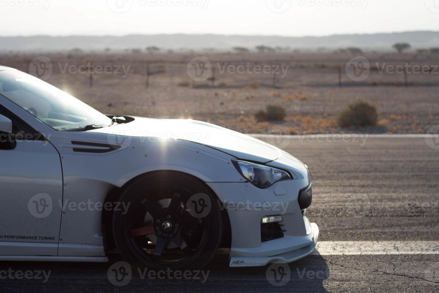 Cars on the race track and on the roads of the desert photo