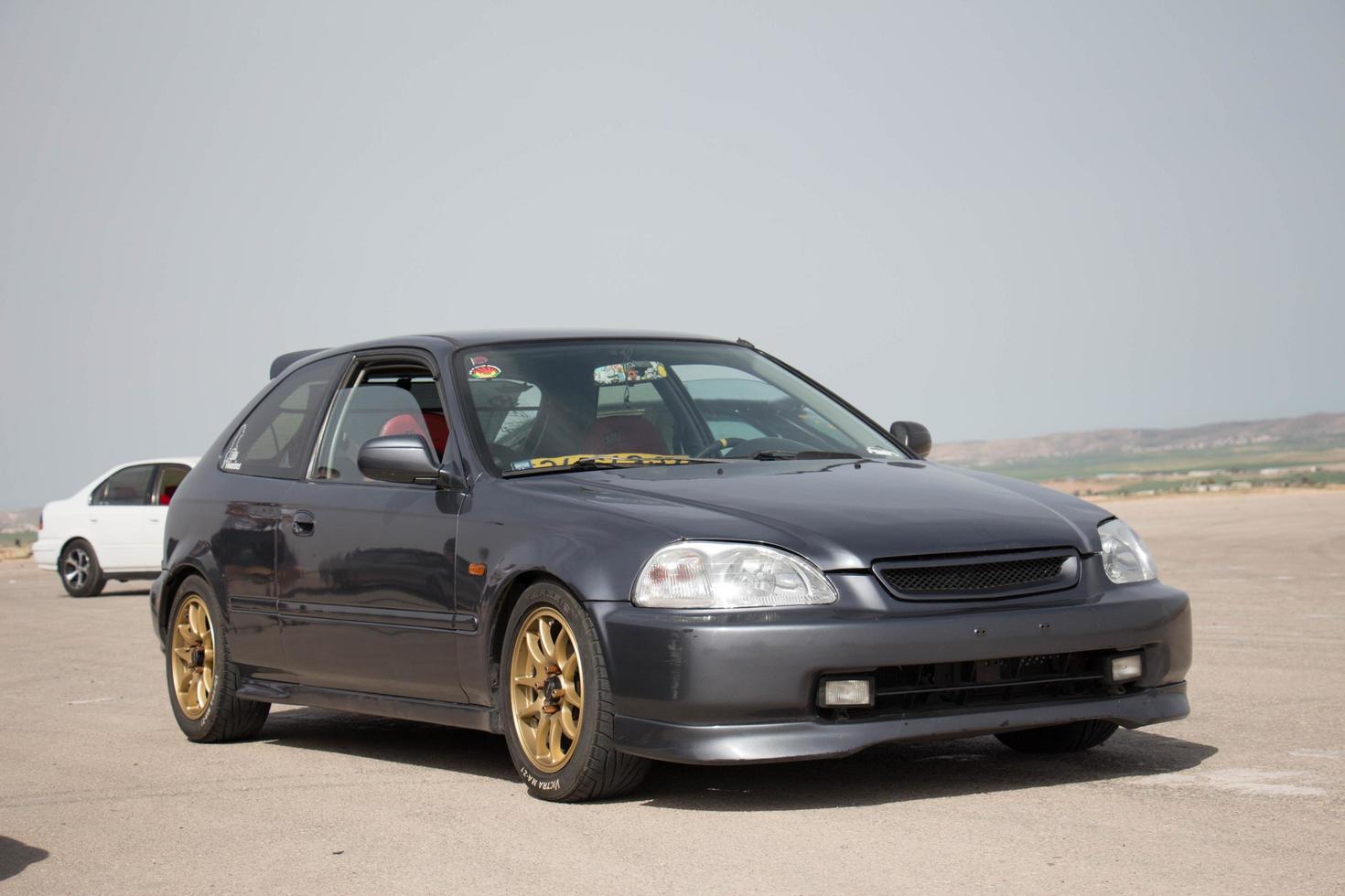 Cars on the race track and on the roads of the desert photo