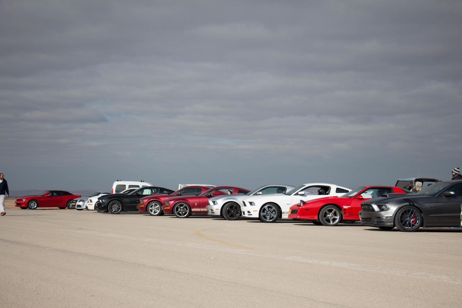 Cars on the race track and on the roads of the desert photo