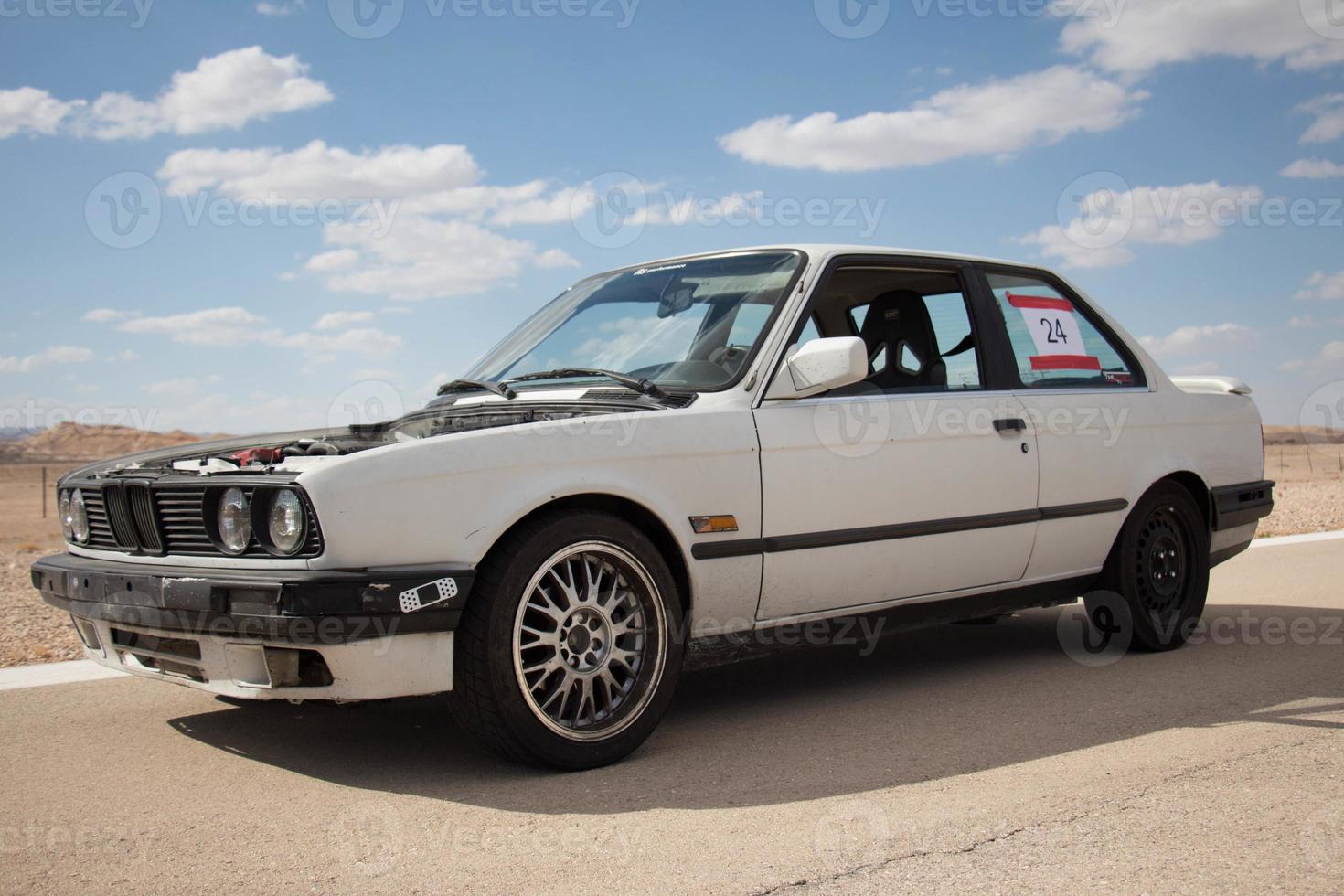 Cars on the race track and on the roads of the desert photo