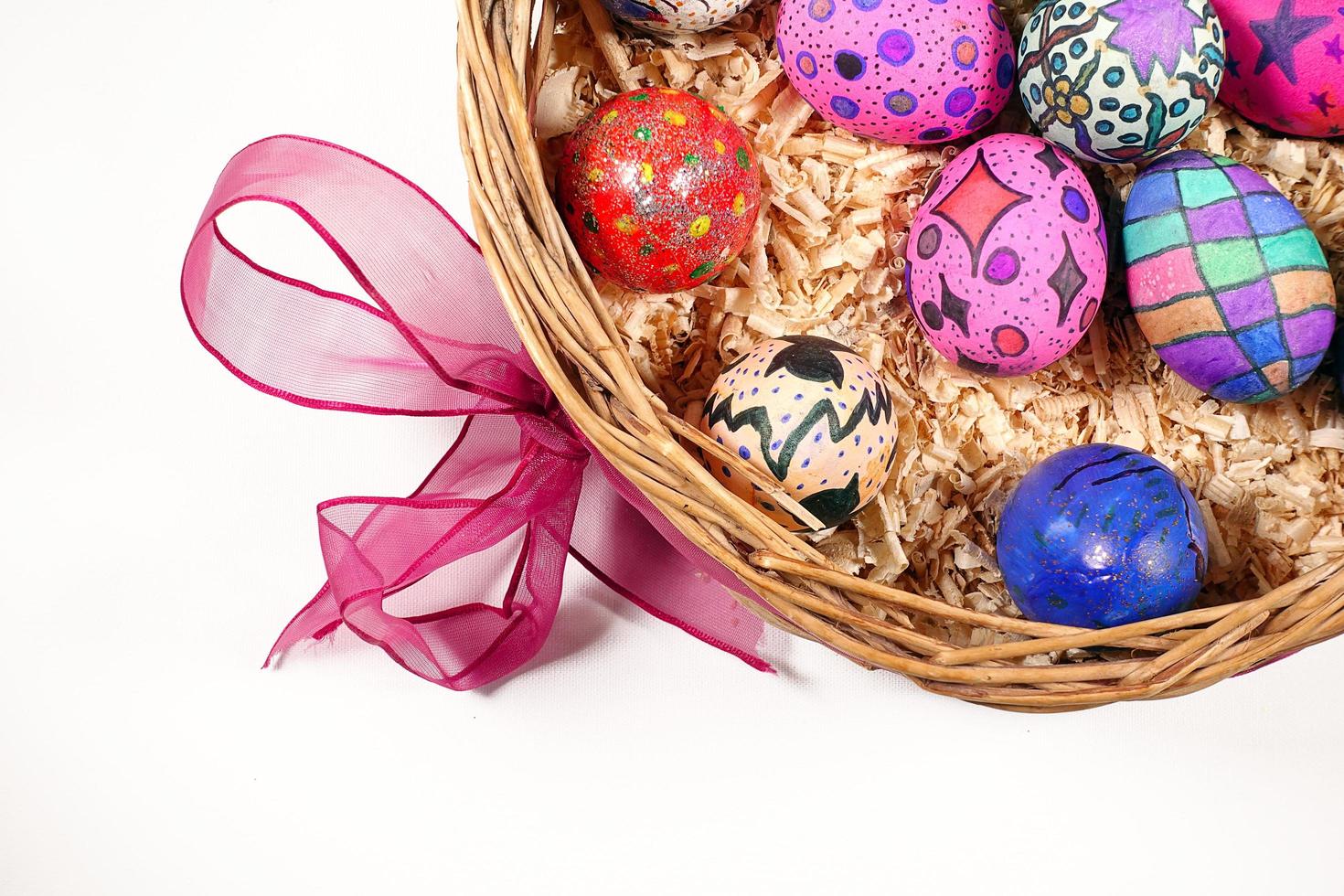 Colorful Easter Eggs in a Wooden Basket photo