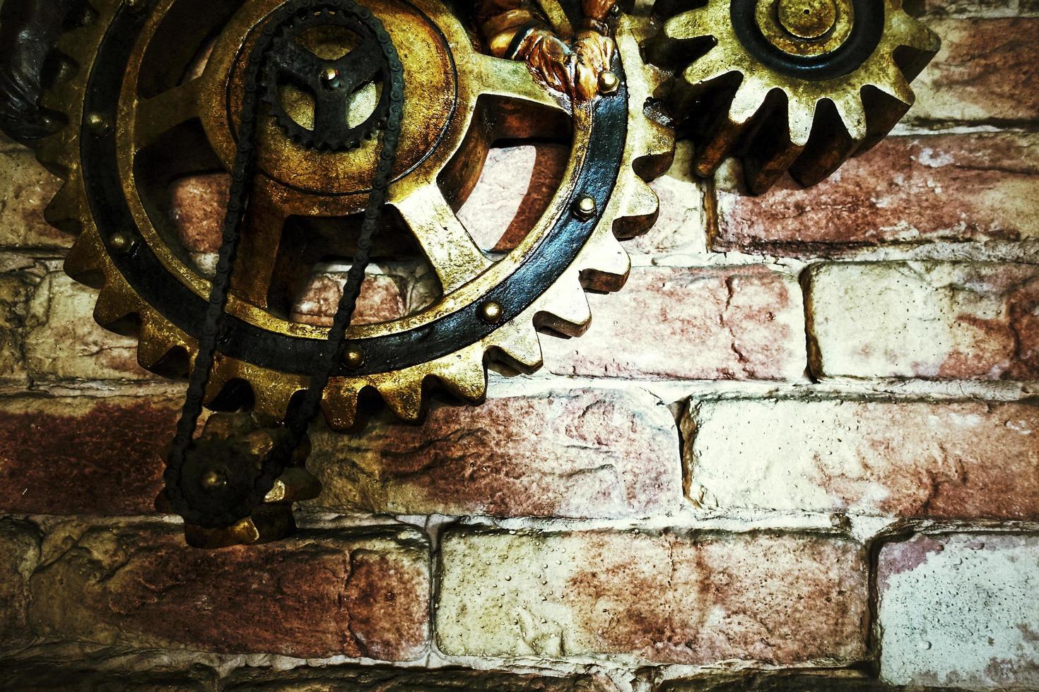 Grunge Rusty Mechanic Gears on Brick Wall photo