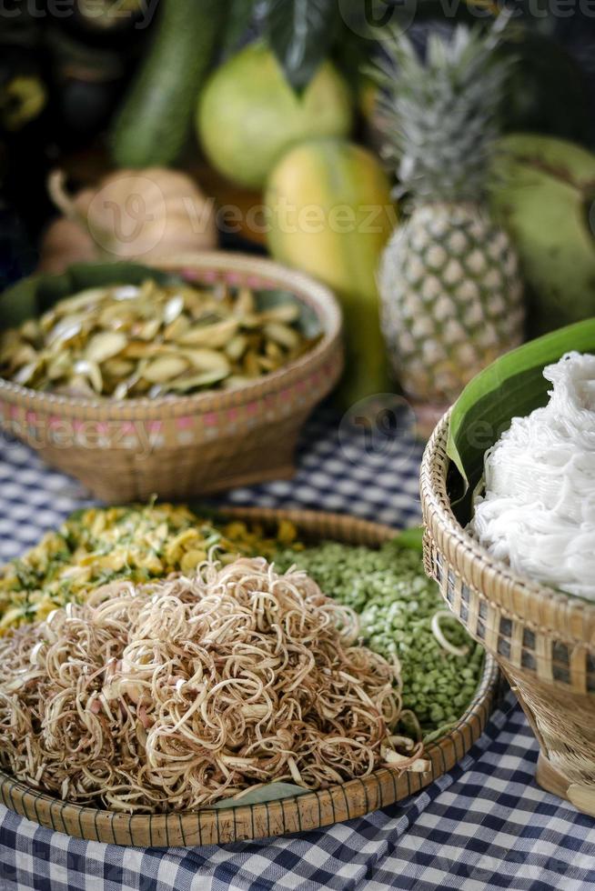 Mixed Cambodian vegetables on traditional restaurant buffet table in Siem Reap with shredded banana blossom in foreground photo