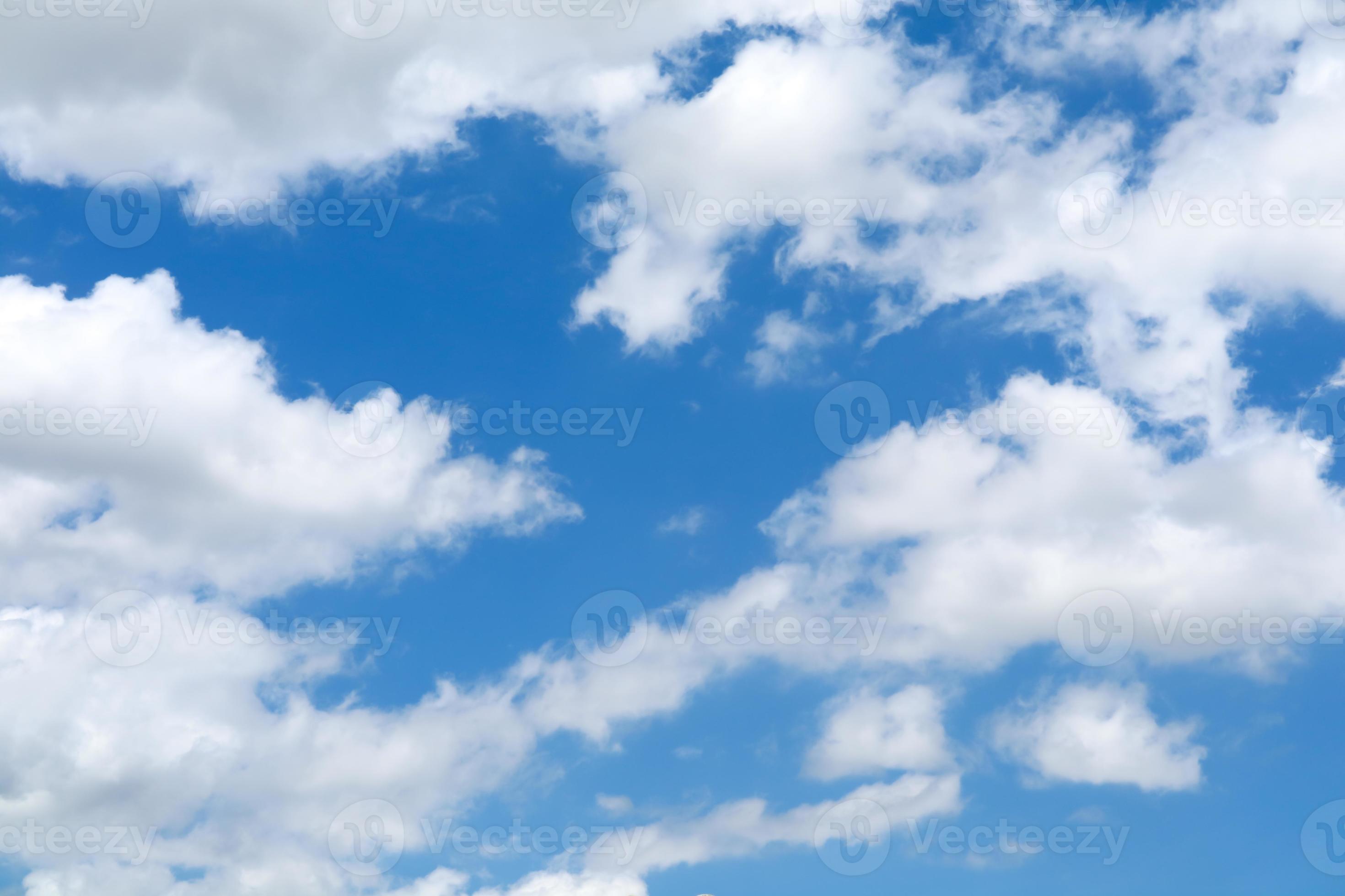Pure blue sky with white clouds and sunlight photo