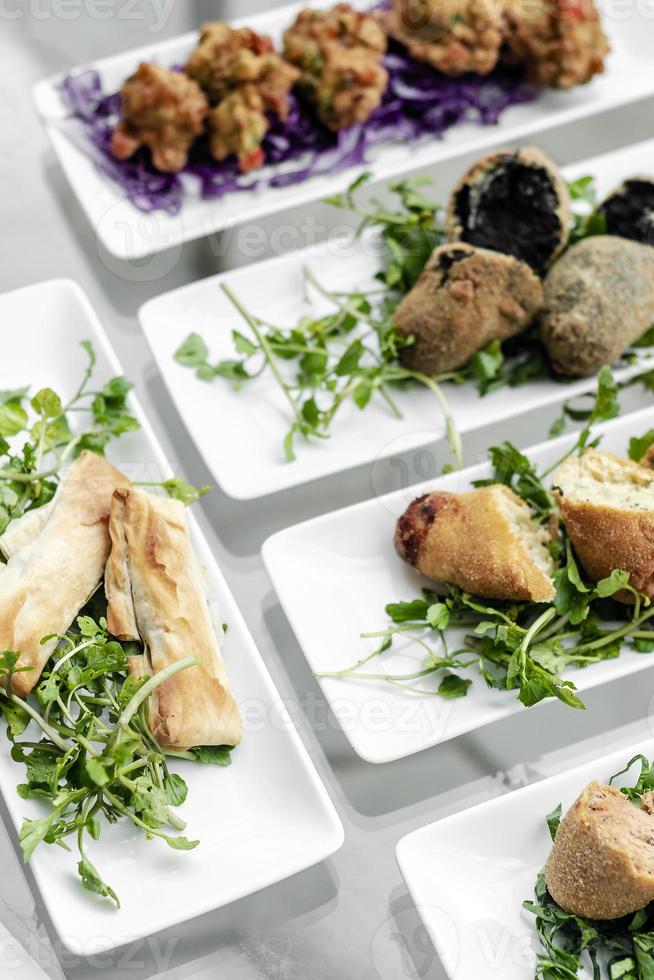 Selection of traditional Portuguese tapas snacks on Lisbon restaurant table photo