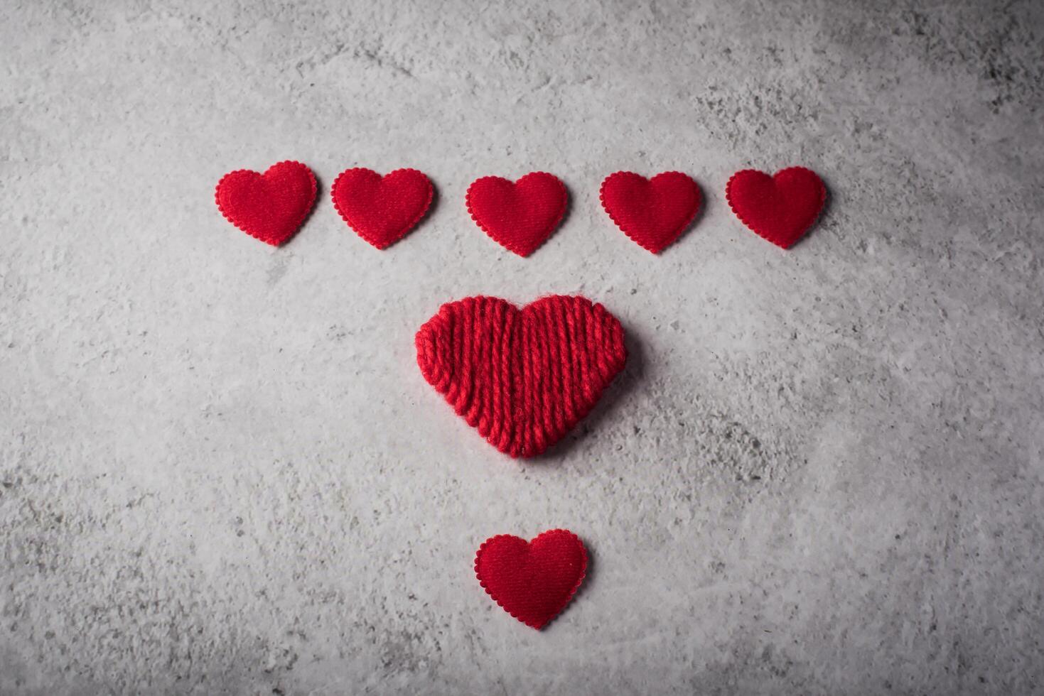 Top view Red heart on wood background. photo