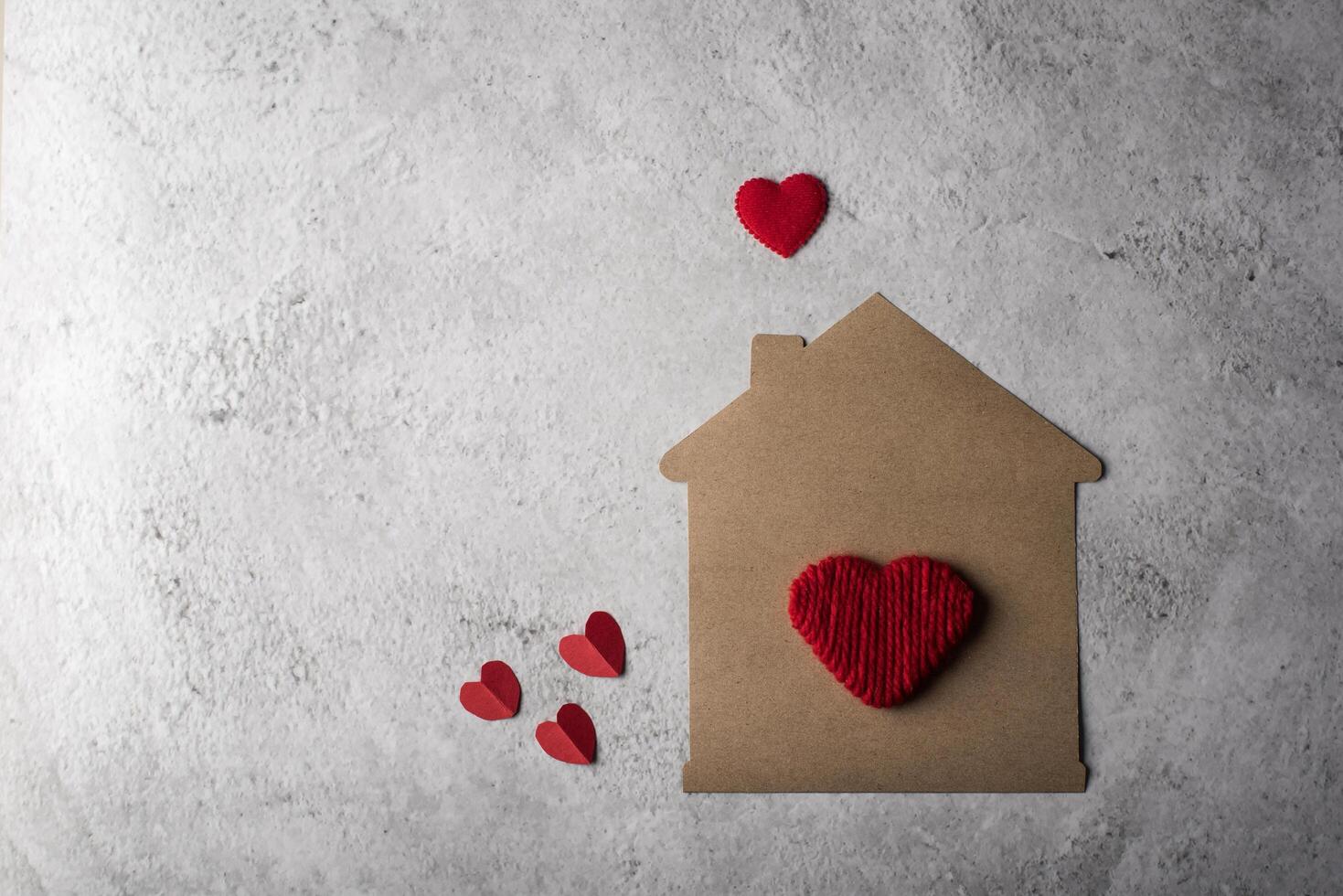 Paper house with heart flat design. photo