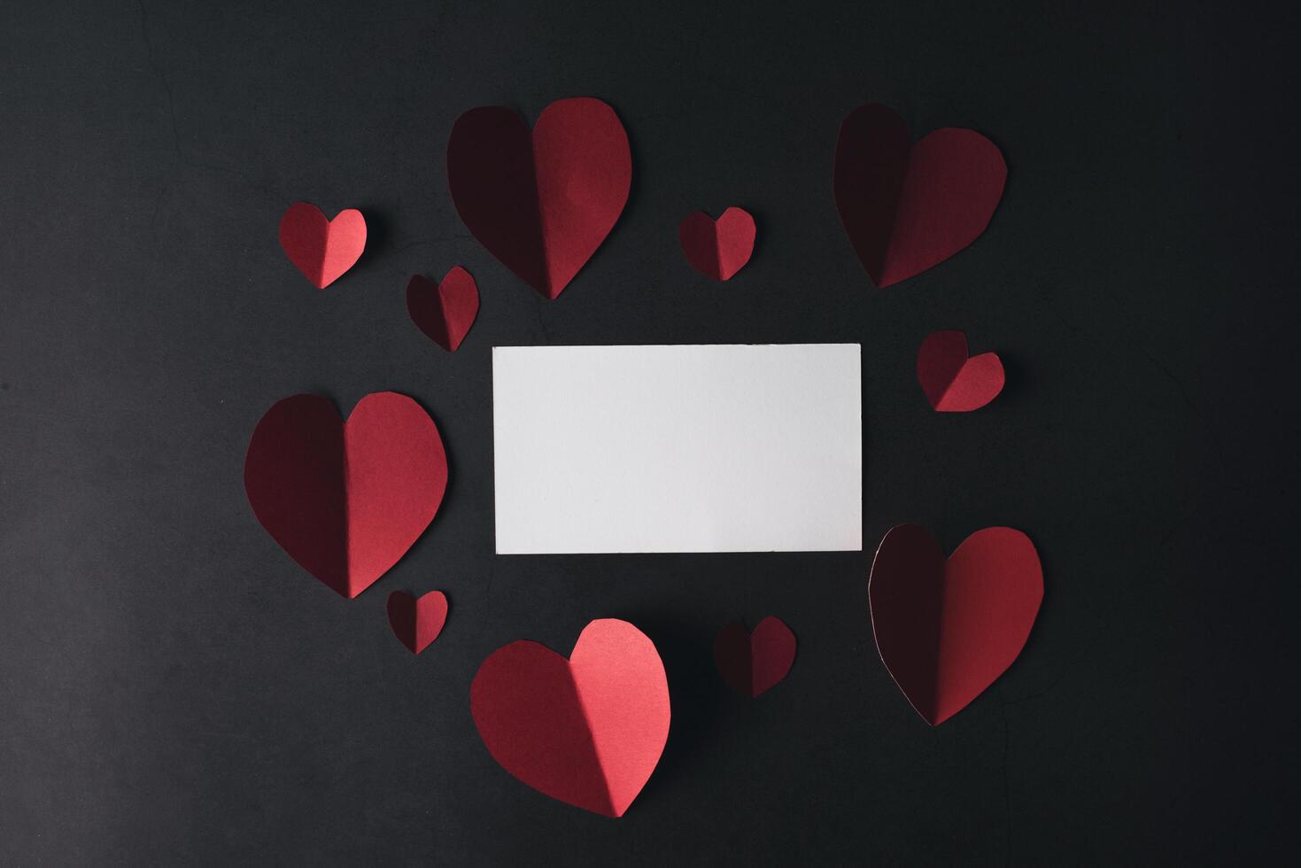 Red Heart paper and blank with note card. photo