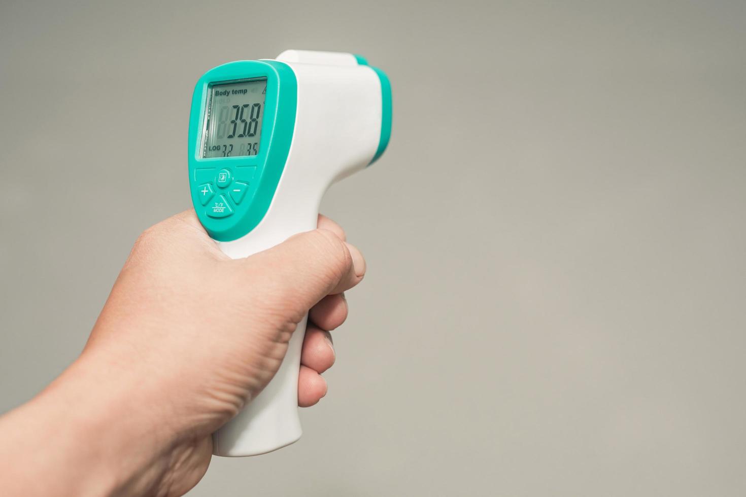 Hand held thermometer to measure fever and free space photo