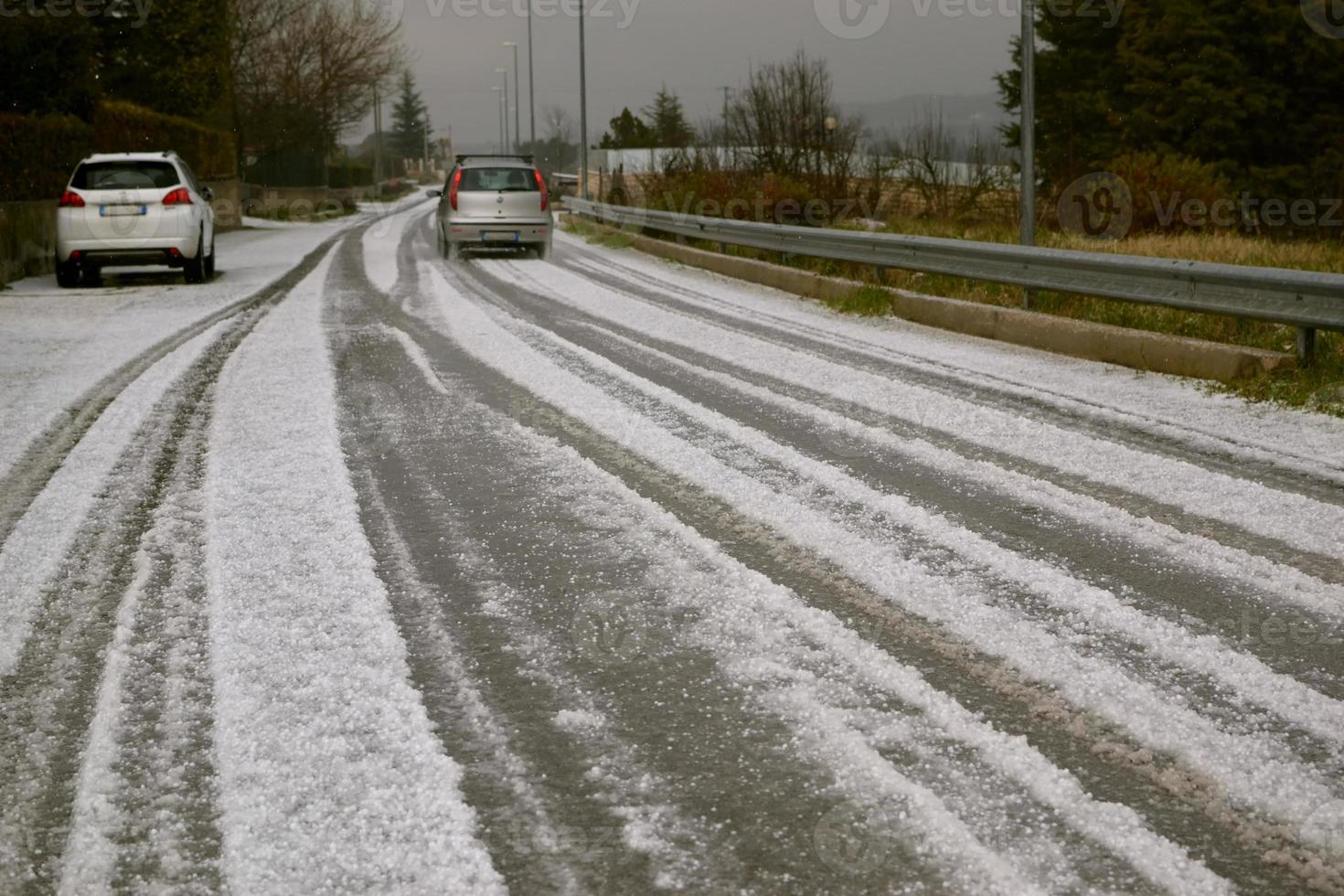 Road with hail that looks like snow. photo