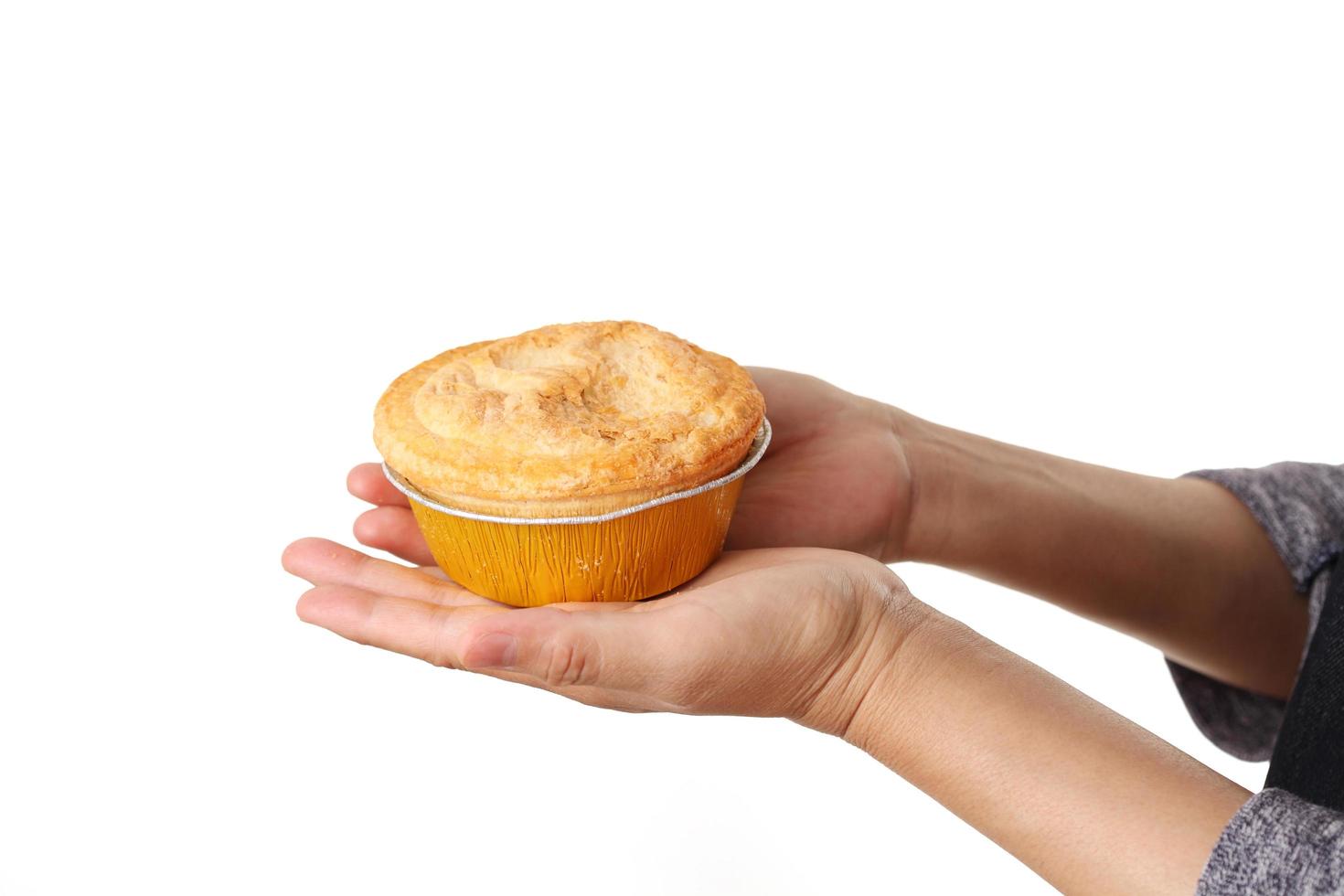 Woman hold meat pie on white background photo