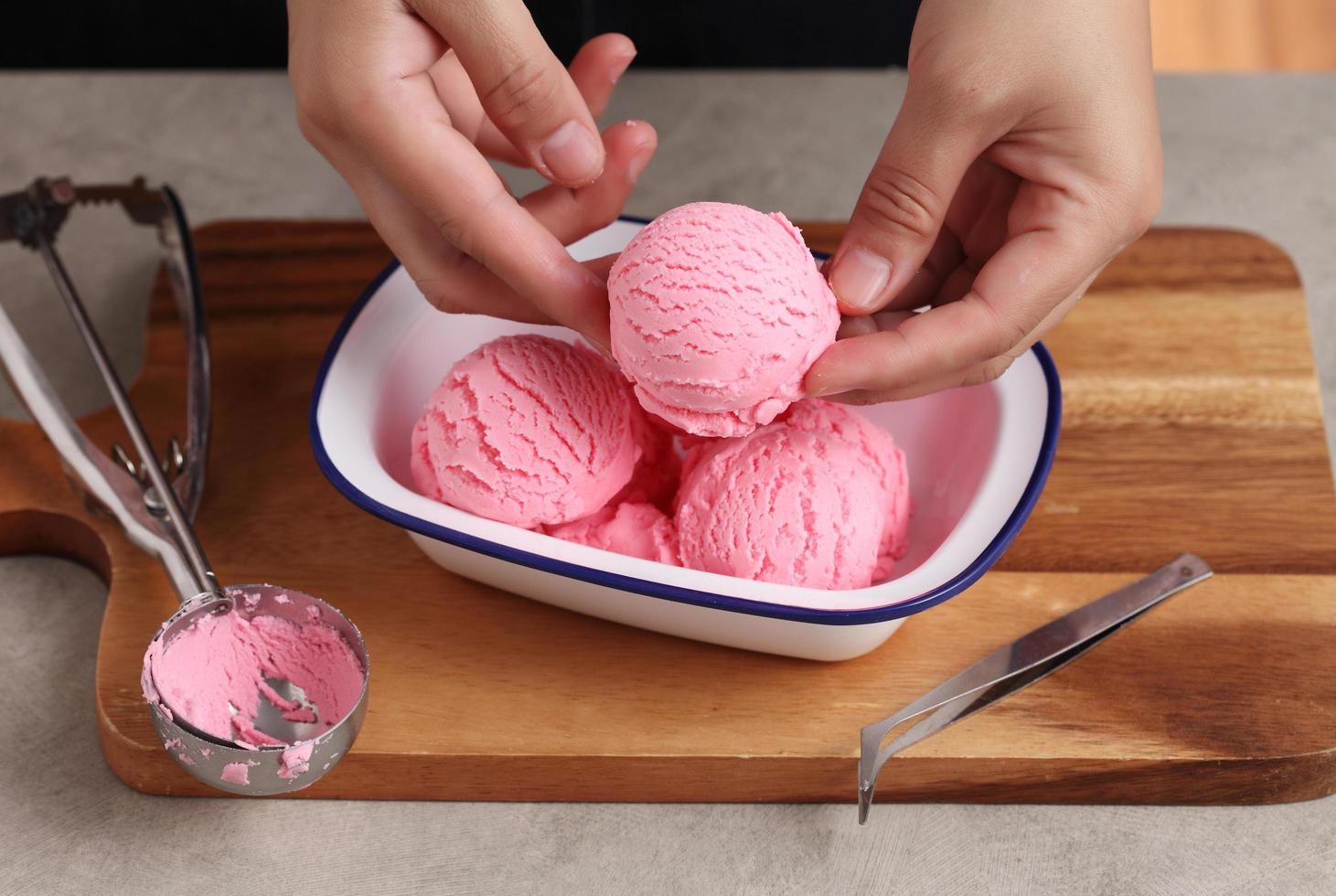 Food stylist use scooper decorating fake icecream photo