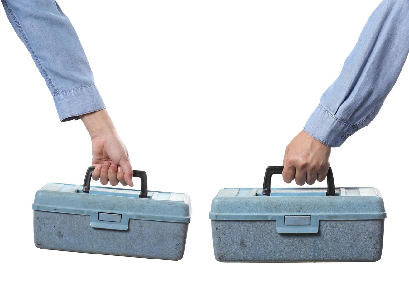 Worker holding tool box on white background photo