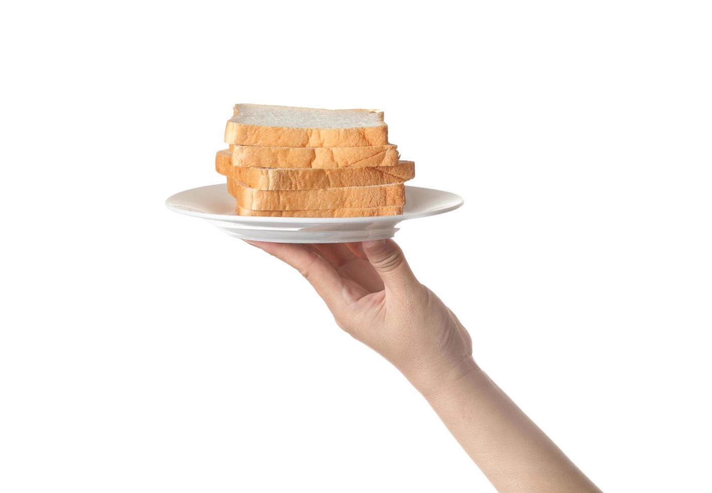 Chef holding toast wheat bread sliced on white background photo