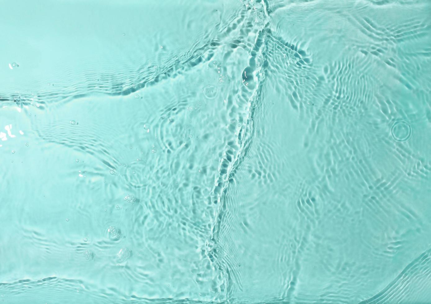 Texture of splashing water on pastel background photo