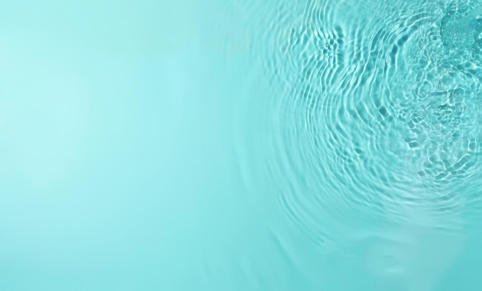 Texture of splashing water on pastel background photo