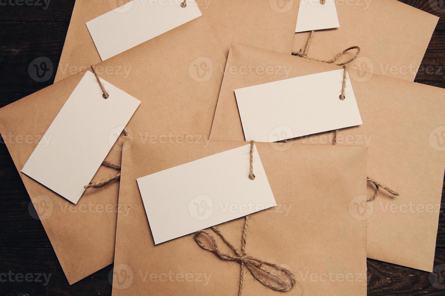 Envelope from kraft paper on a wooden table photo