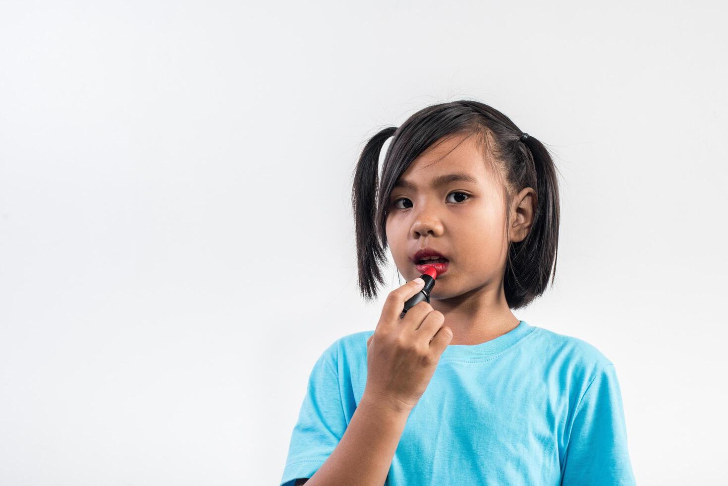 Portrait little girl makeup with her face. photo