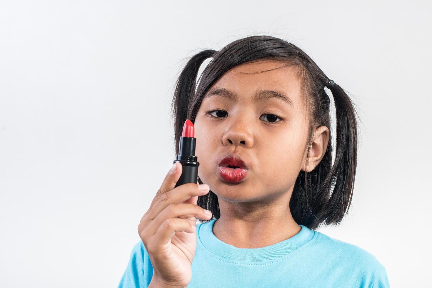 Portrait little girl makeup with her face. photo