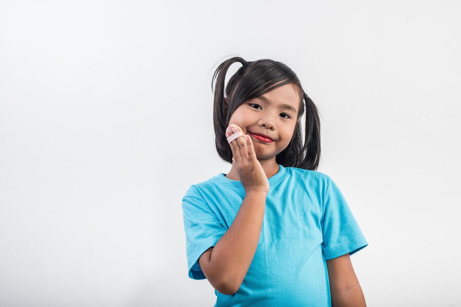 Portrait little girl makeup with her face. photo