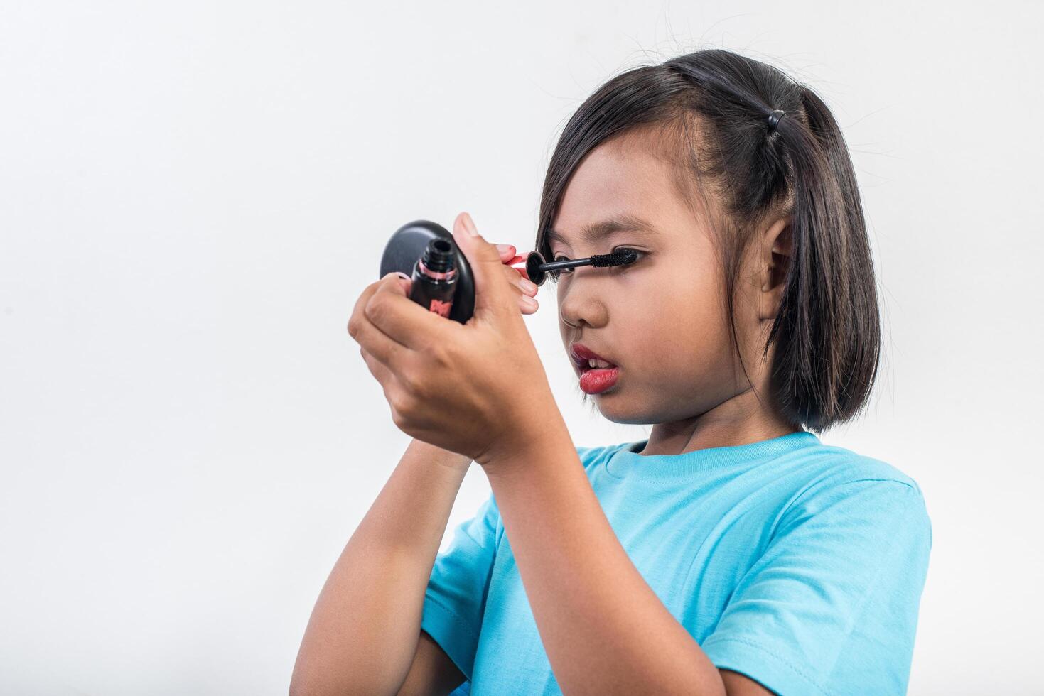 Portrait little girl makeup with her face. photo