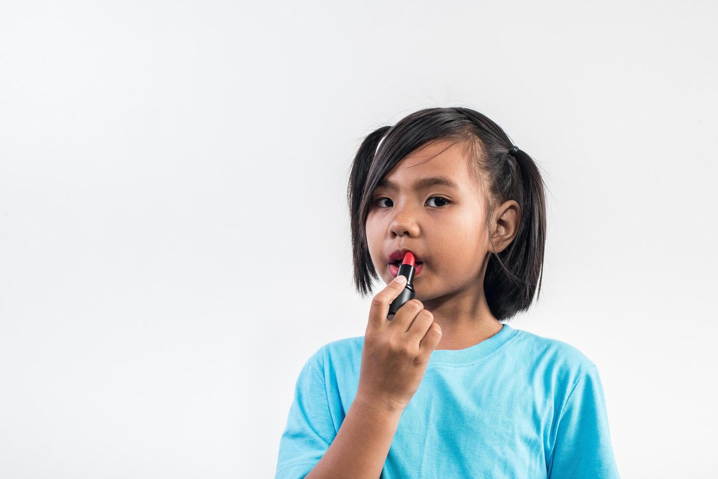 Portrait little girl makeup with her face. photo