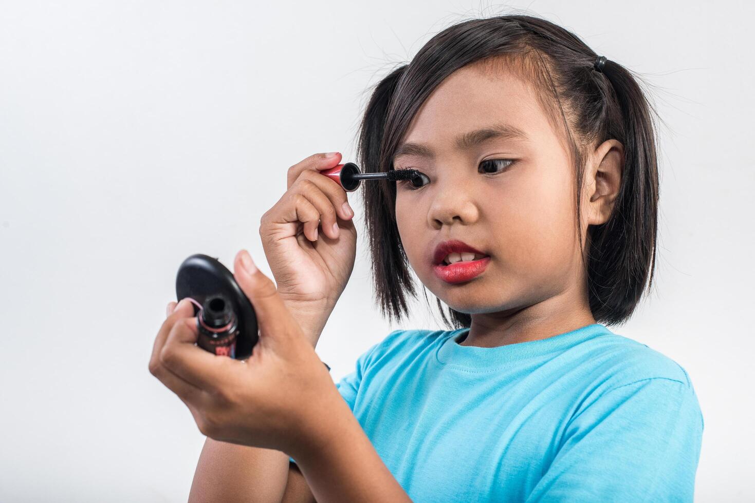 Portrait little girl makeup with her face. photo