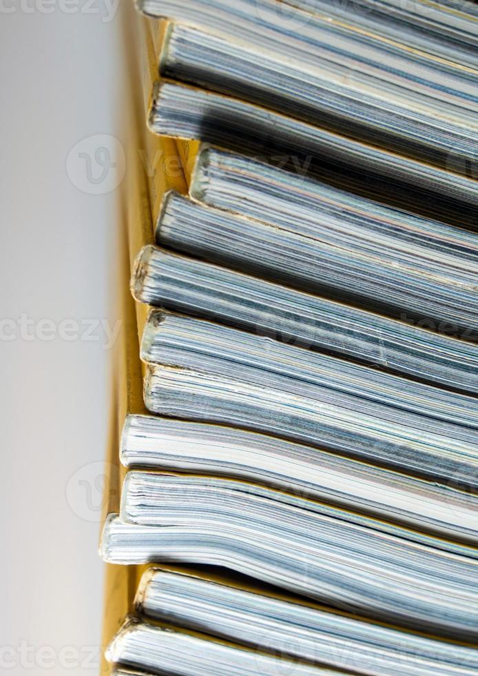 Stack of yellow monthly magazine photo