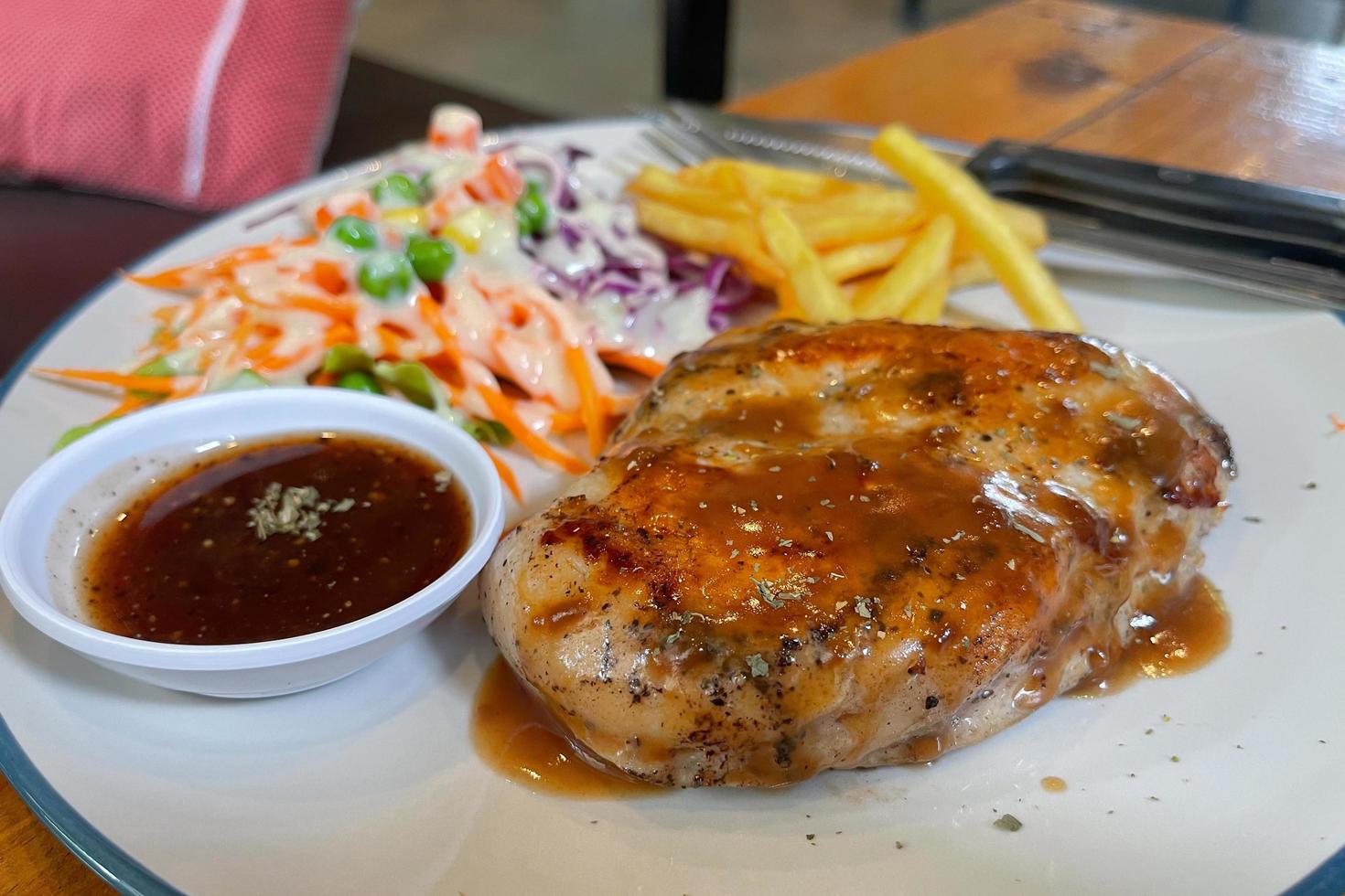 Pork bones on black pepper photo